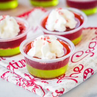 close up christmas jello shots with whipped cream