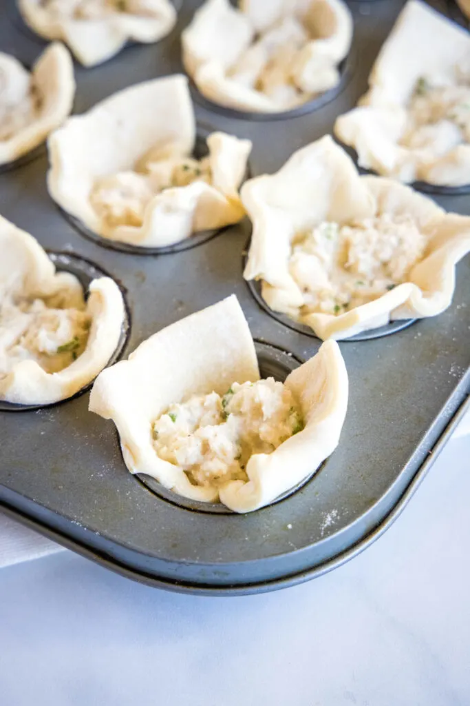 puff pastry in muffin tins filled with crab mixture