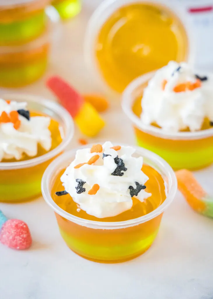 halloween jello shots with whipped cream and sprinkles
