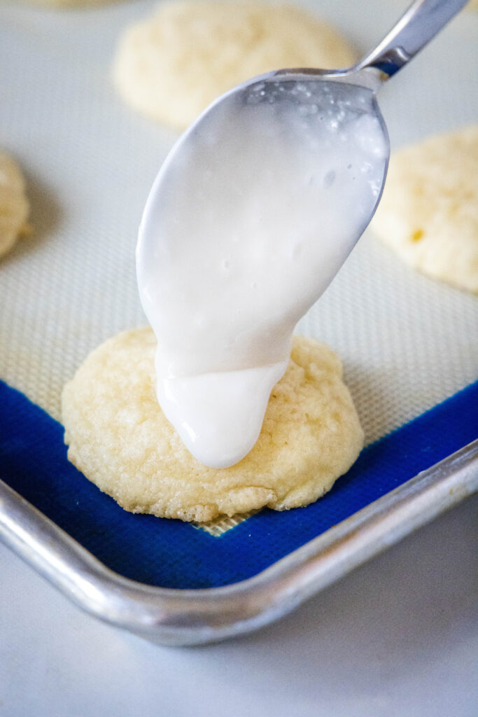 putting glaze on sour cream cookies