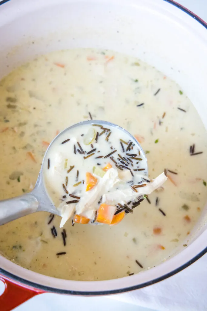 a ladle full of turkey wild rice soup