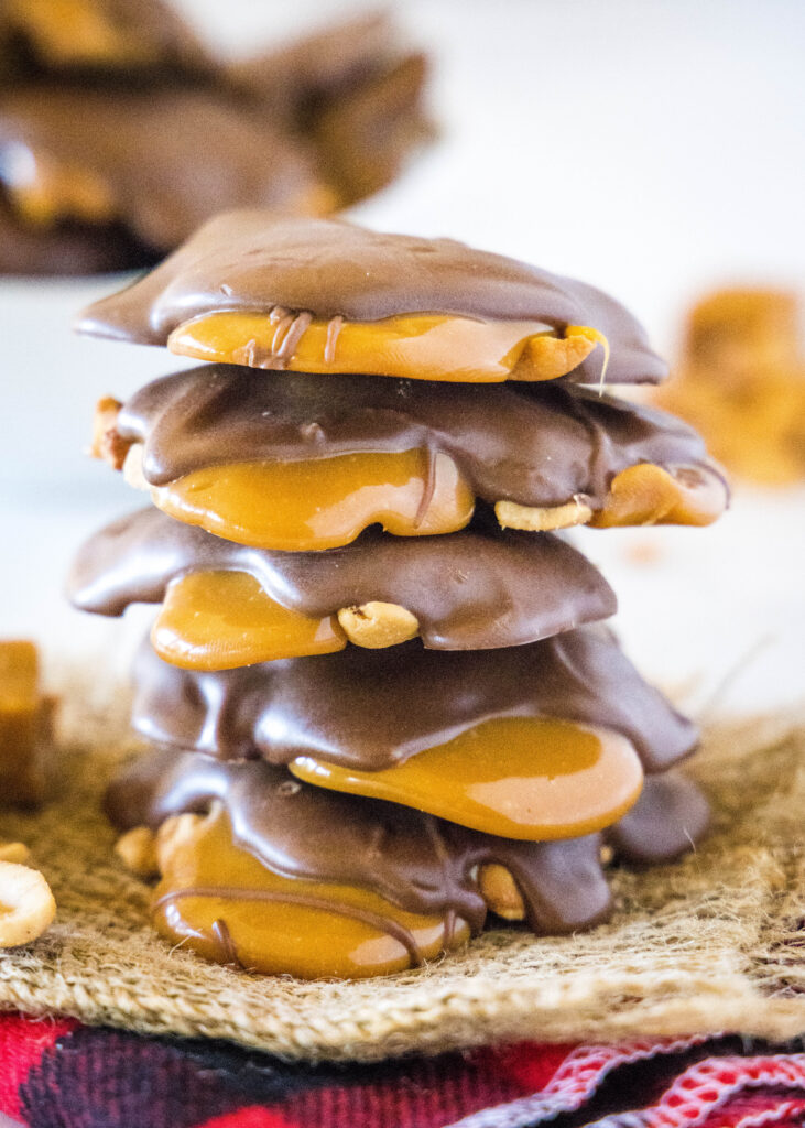 stacked caramel cashew clusters on a table