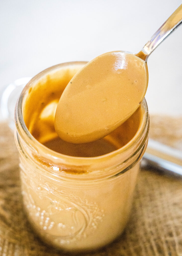 creamy balsamic dressing on a spoon