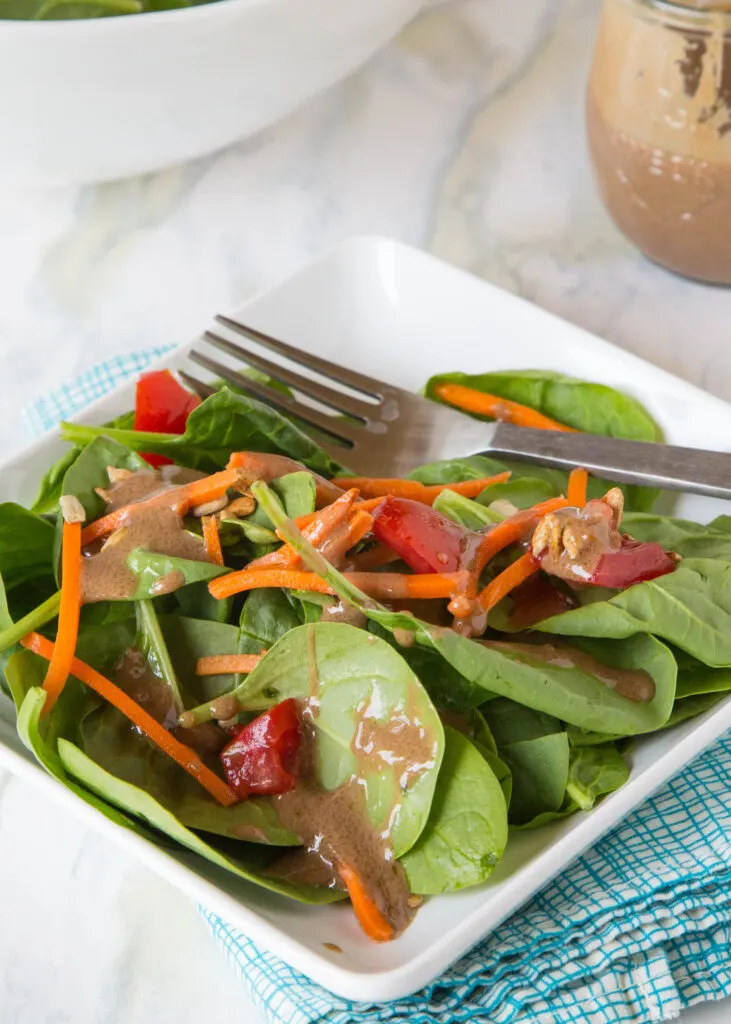 salad with creamy balsamic dressing on it