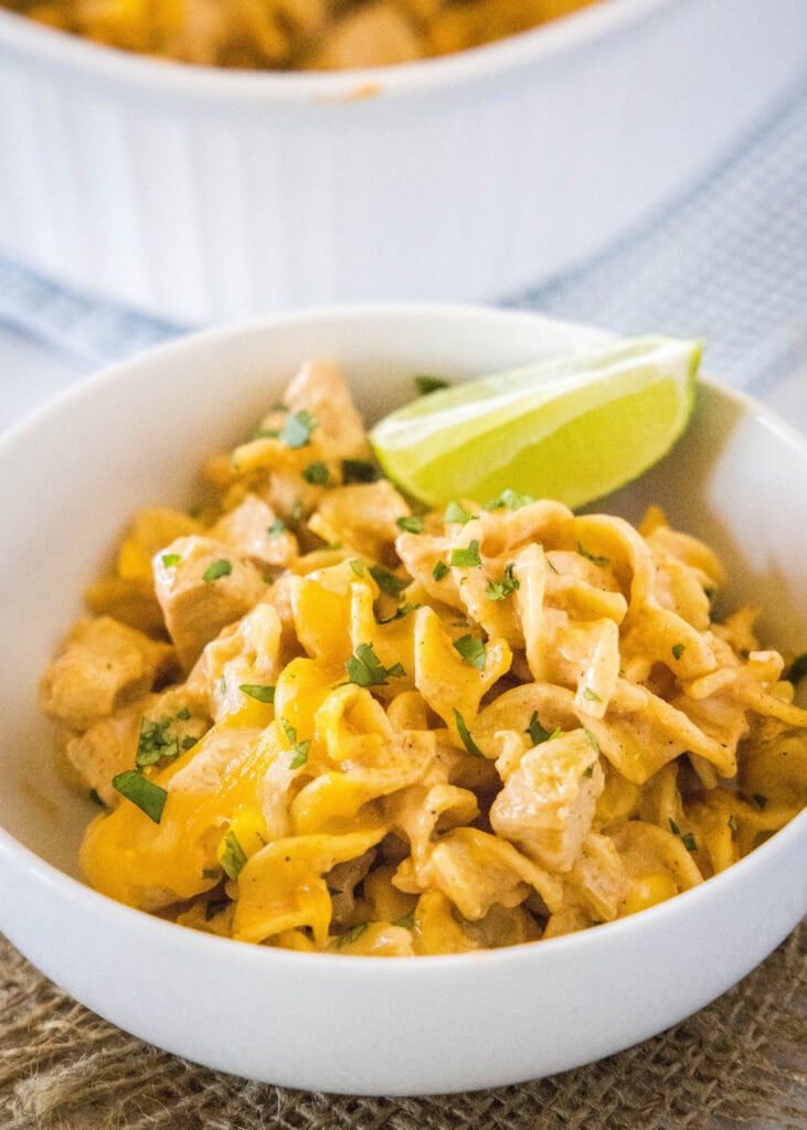 pasta topped with cheese and cilantro in a bowl