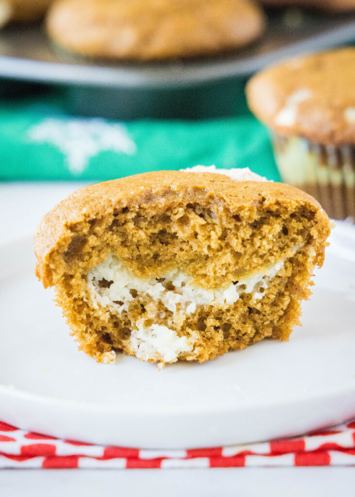 muffin cut in half showing the cream cheese layer