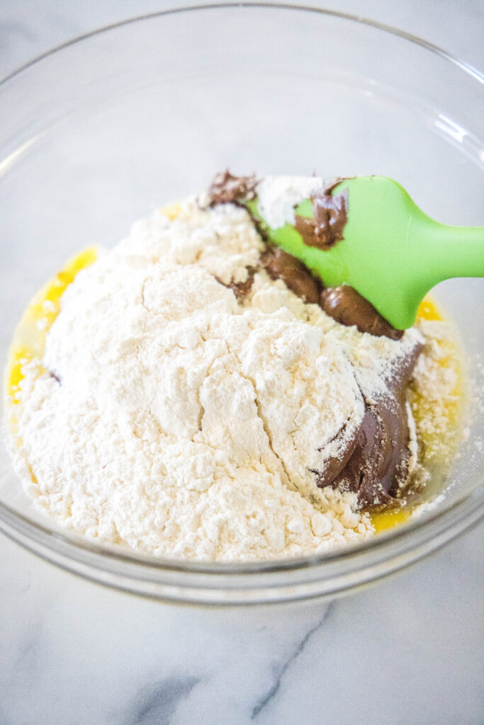 eggs, nutella and flour in a bowl