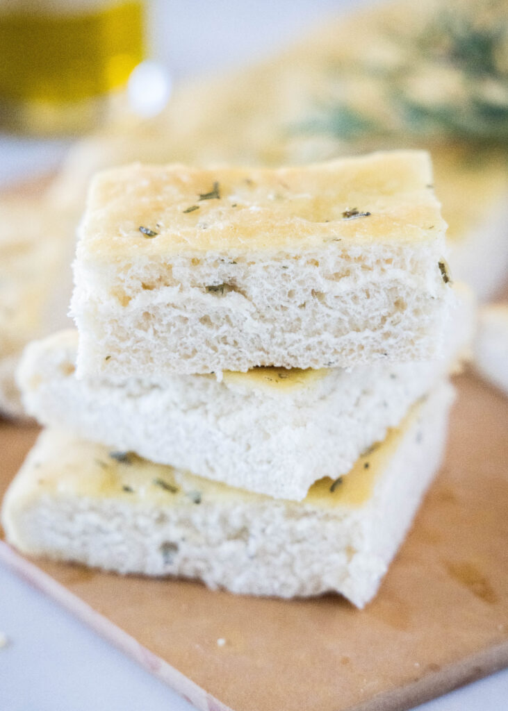 stacked focaccia bread on a cutting board