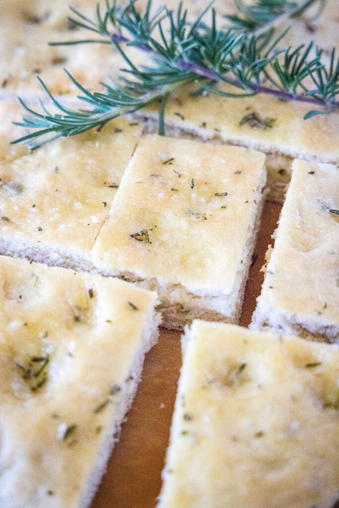 sliced focaccia bread on a cutting board