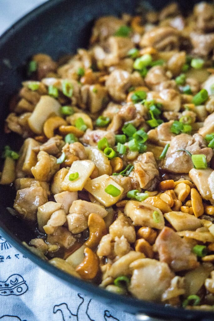 cashew chicken stir fry in a skillet