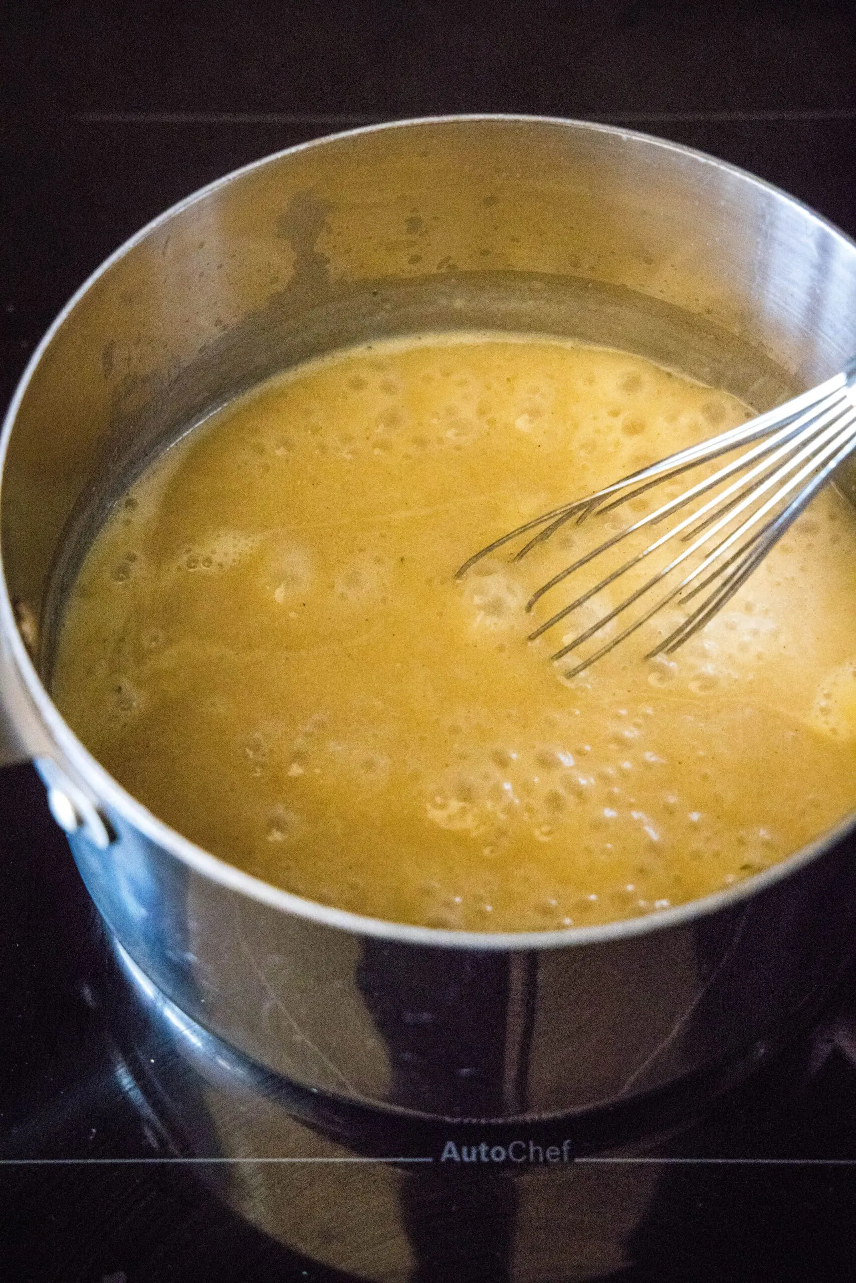 gravy simmering in a saucepan