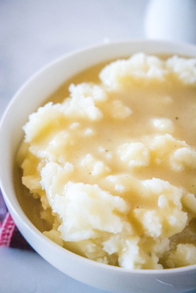 bowl of mashed potatoes with kfc gravy