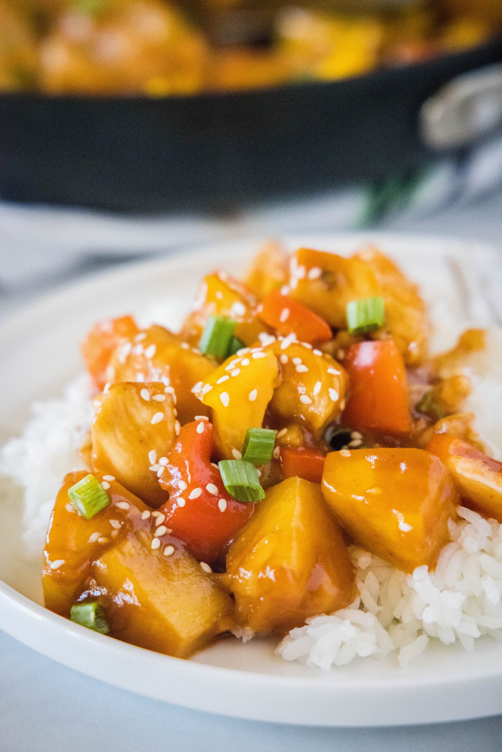 chicken stir fry over rice on a plate