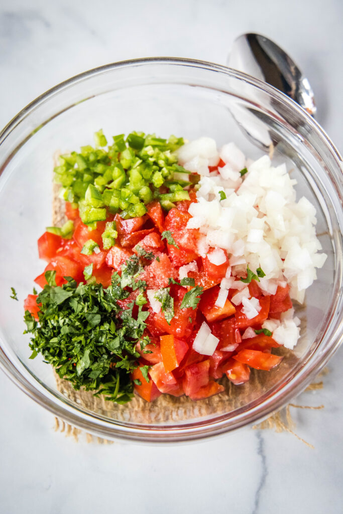 Place the ingredients for the pico de gallo in the mixing bowl