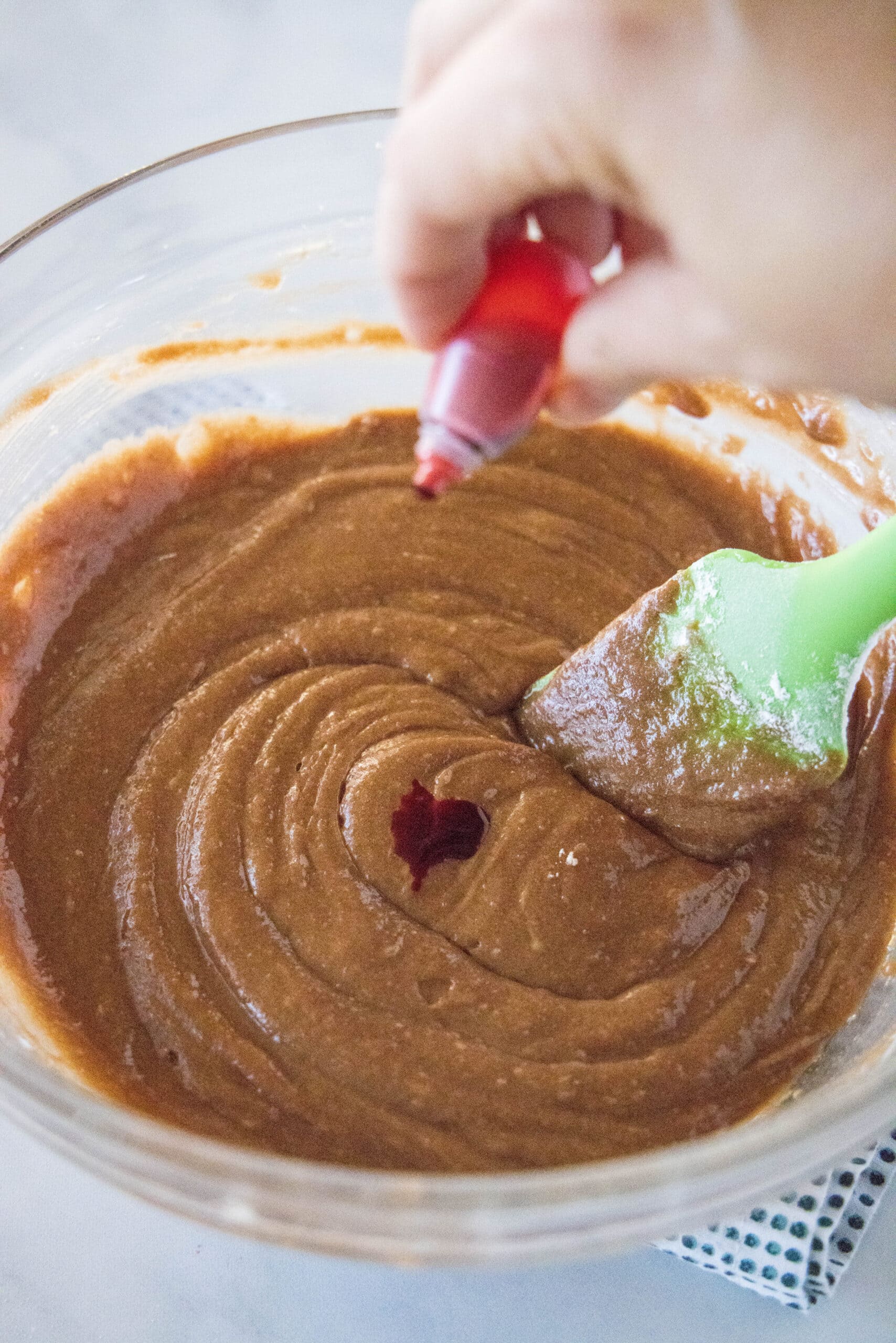 adding food coloring to brownie batter