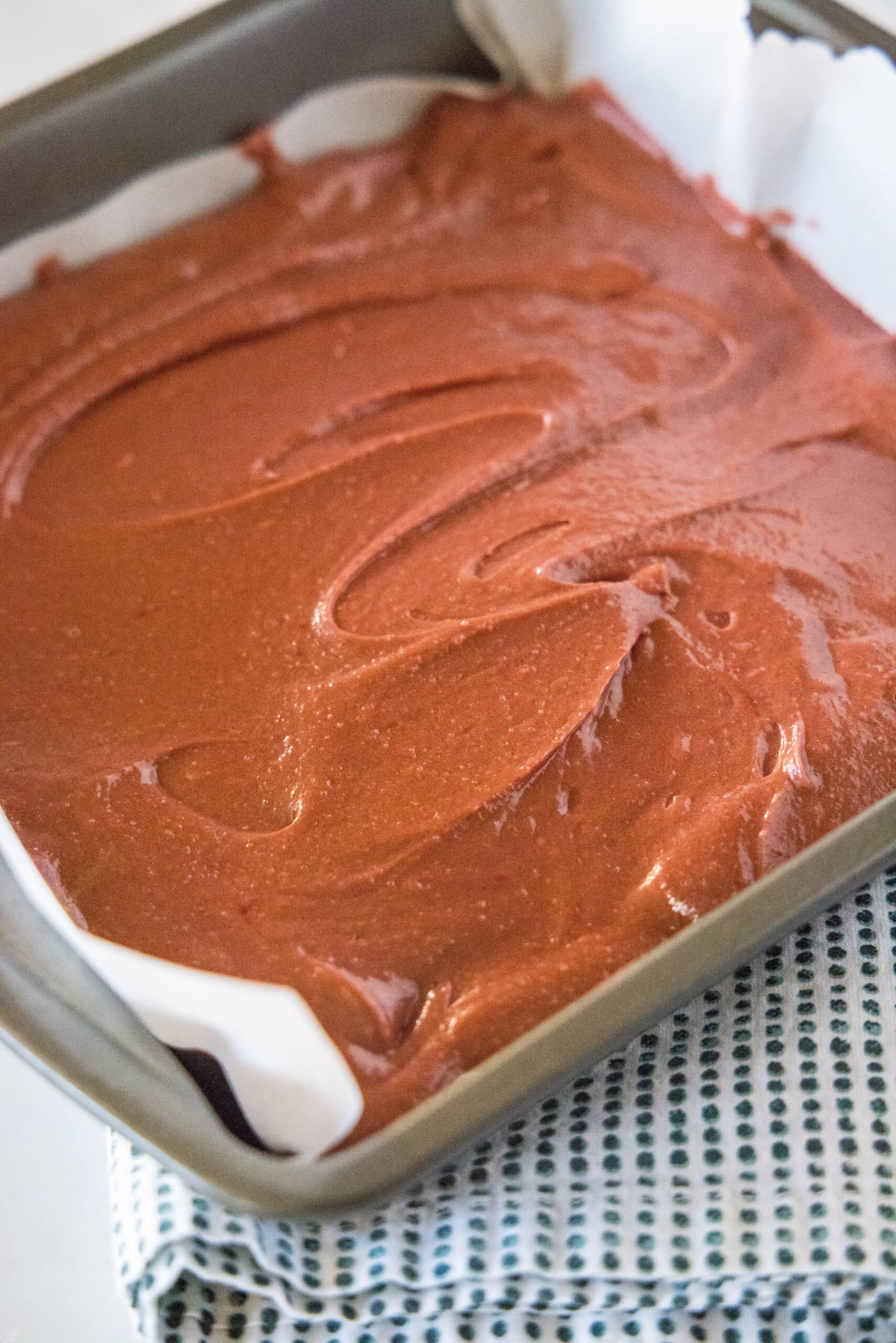 red velvet brownie batter in baking pan