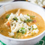 cropped close up buffalo chicken chili in a white bowl