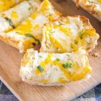 sliced garlic bread on a cutting board