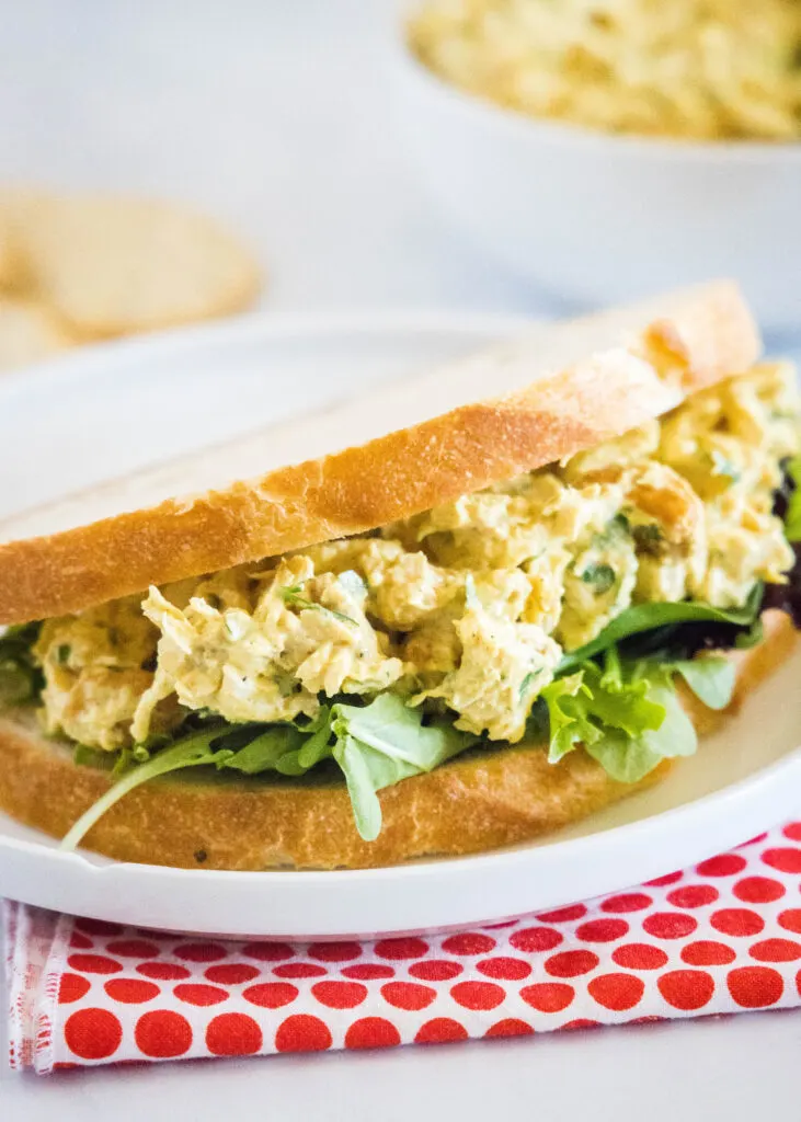 curry chicken salad on bread with greens