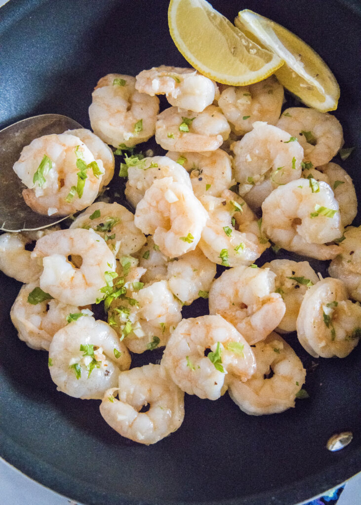 looking down on a skillet with shrimp scampi