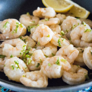 cropped close up shrimp scampi in a pan