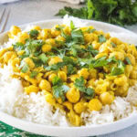 close up chickpea curry on a white plate