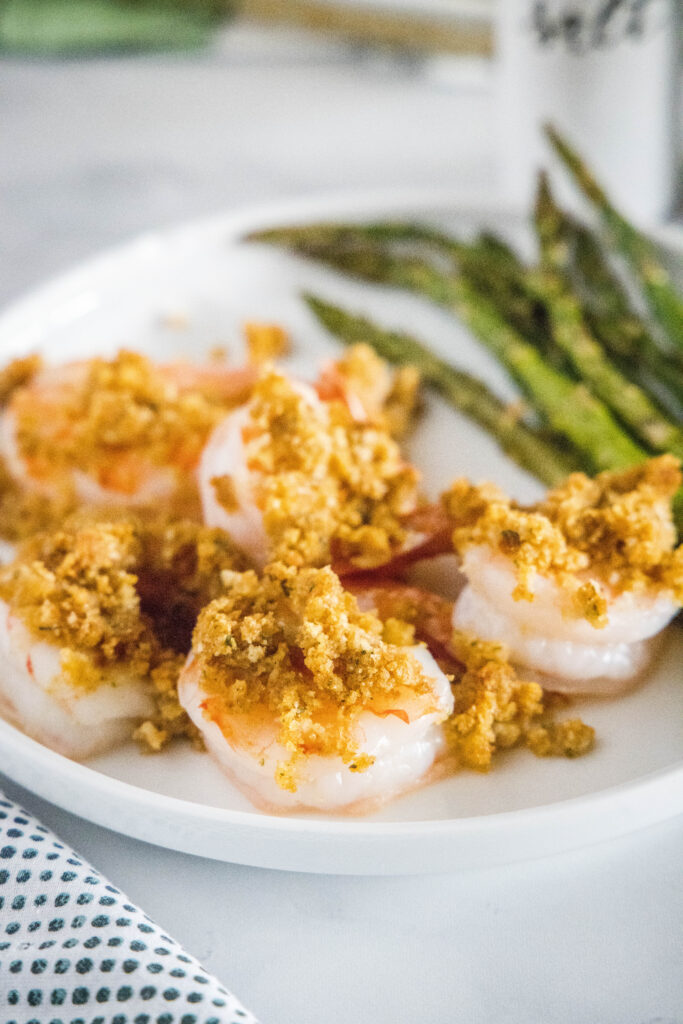 crispy baked shrimp on a plate with asparagus