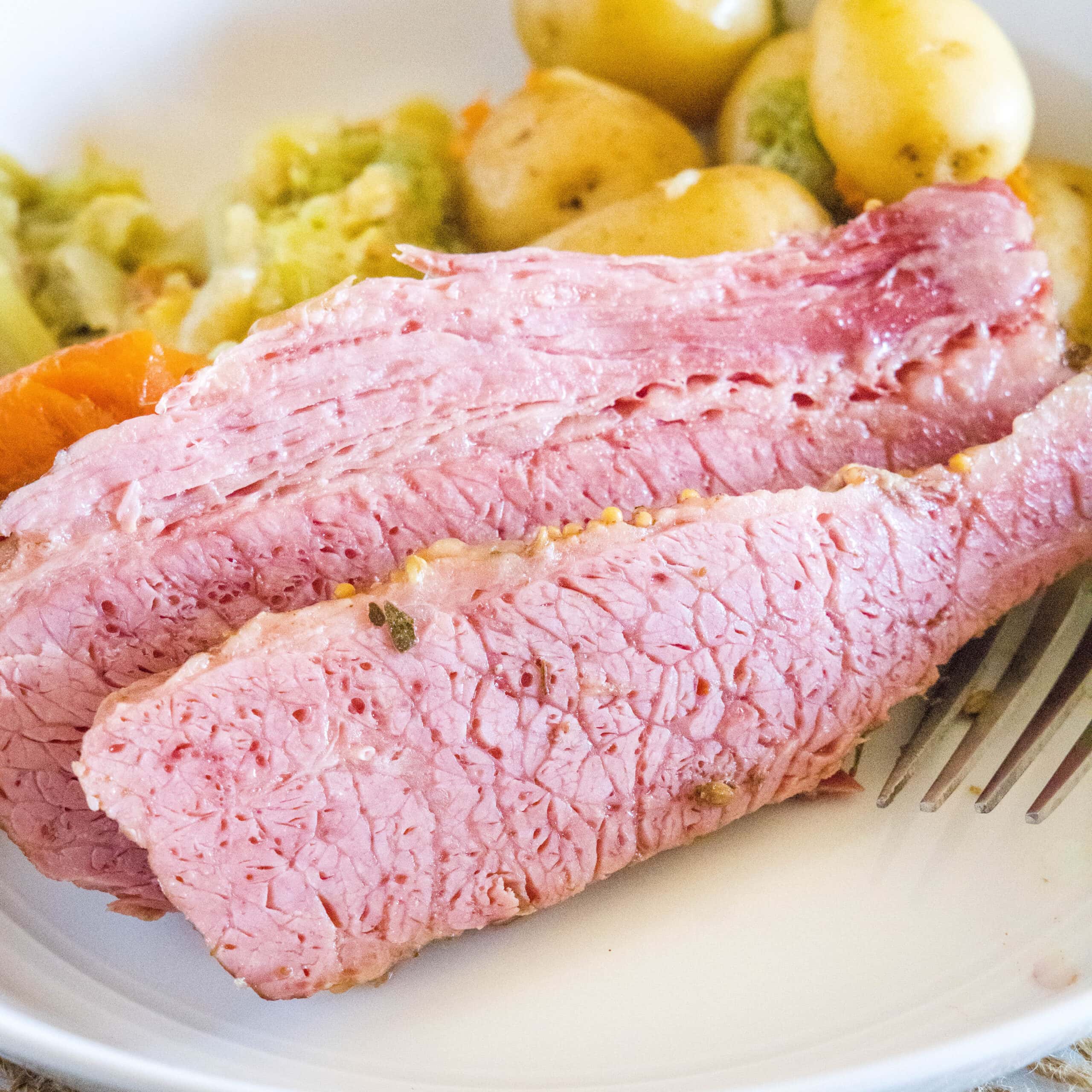 close up sliced corned beef on a plate