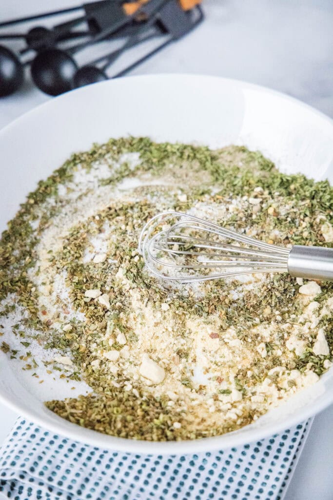 spices being mixed together on a plate