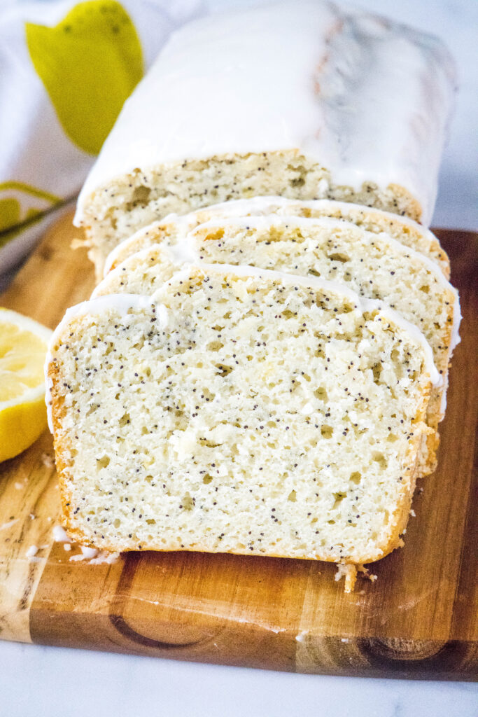 lemon poppy seed bread slices on cutting board
