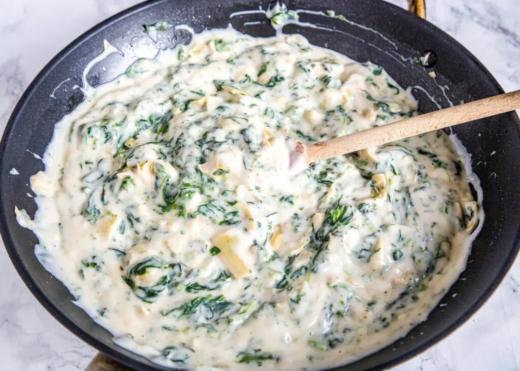 spinach aritchoke sauce in a skillet