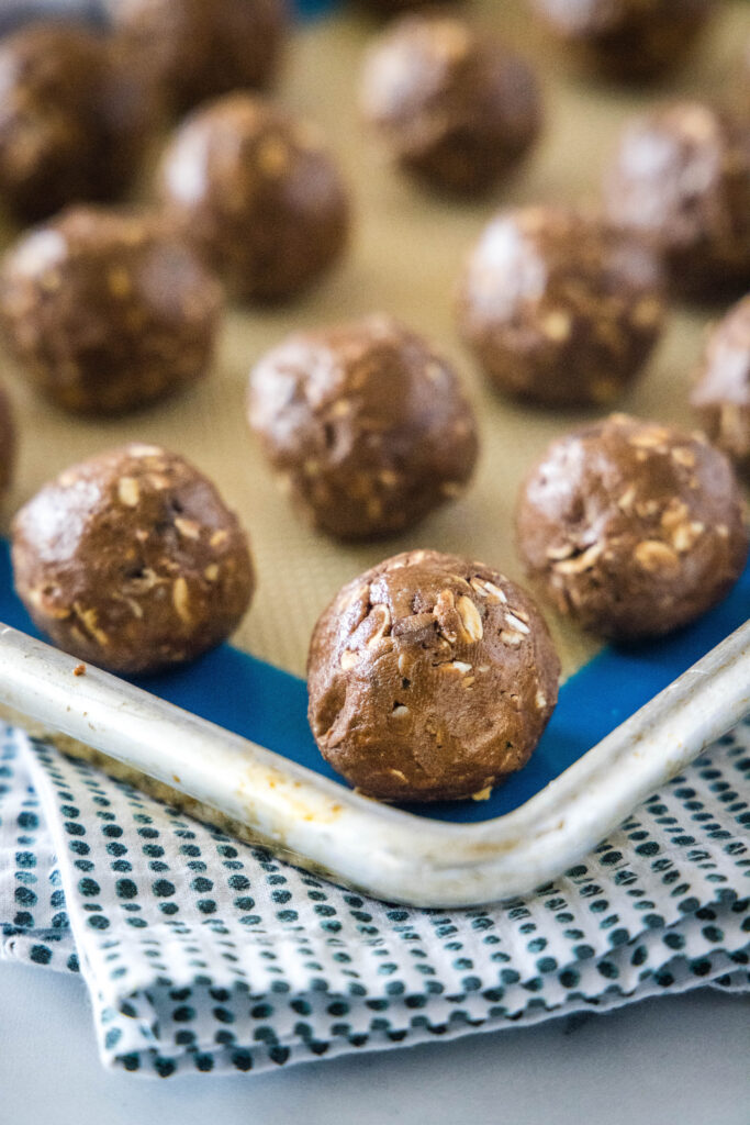 chocolate protein balls on baking sheet