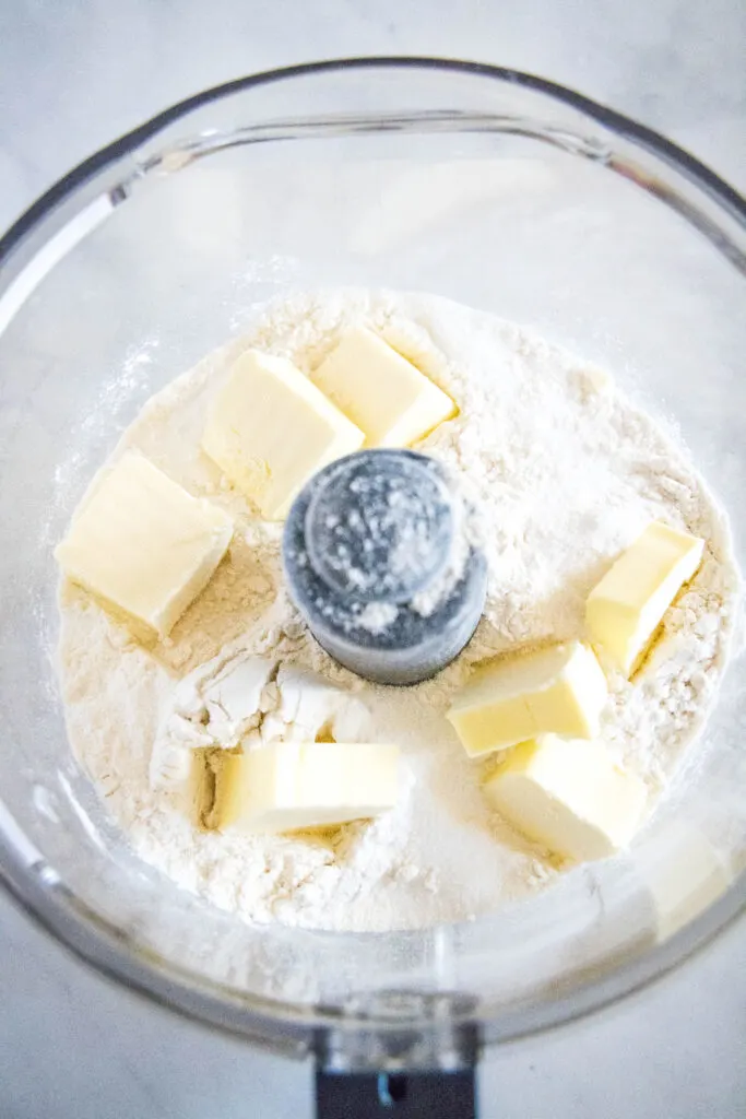 flour and butter in food processor bowl