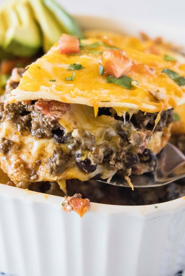 close up slice of burrito casserole on a spatula