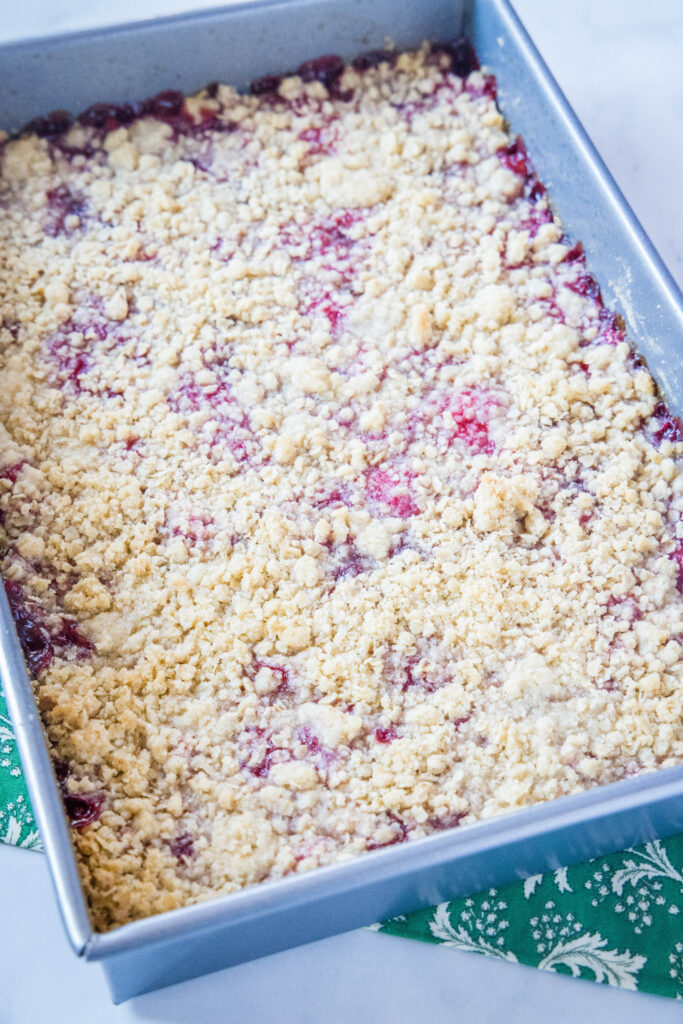 baked raspberry crumble bars in pan
