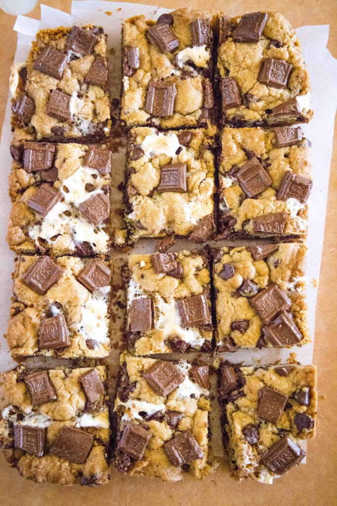 Looking down at sliced ​​S'mores bar cookies on a cutting board