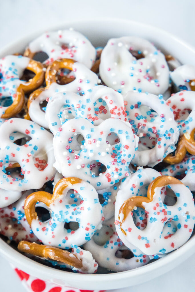 red white and blue pretzels in a white serving bowl