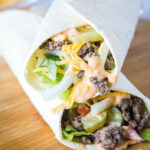 Two burger wraps on top of each other diagonally