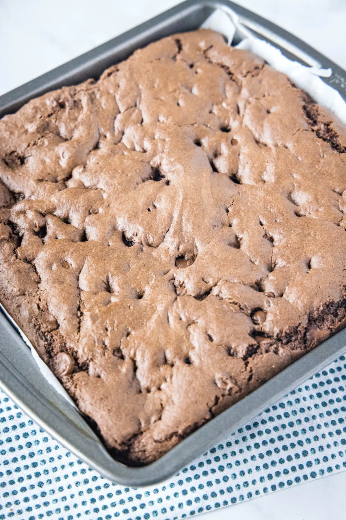 Overhead view of a square baking dish filled with brownies