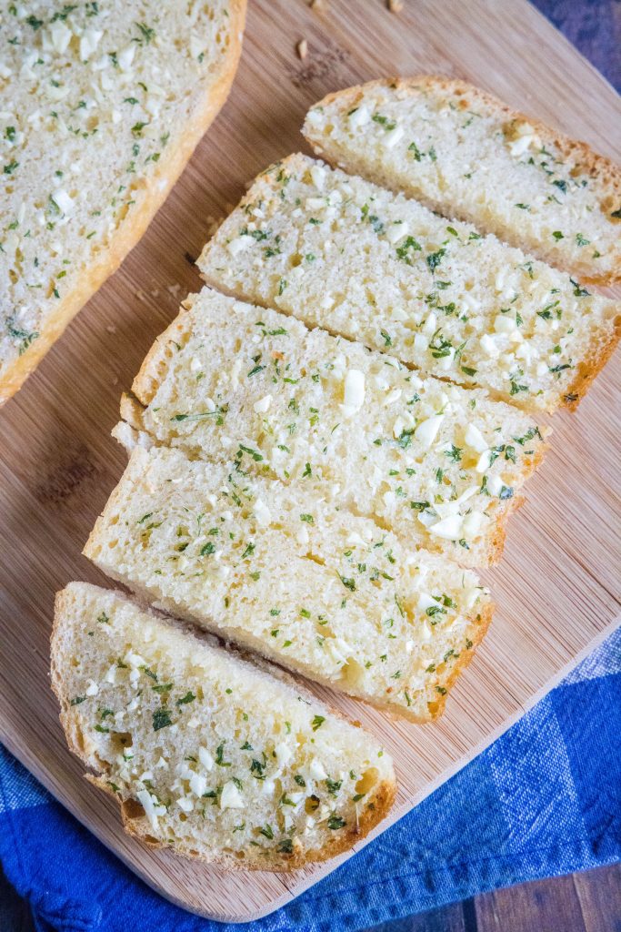 sliced garlic bread on a cutting board