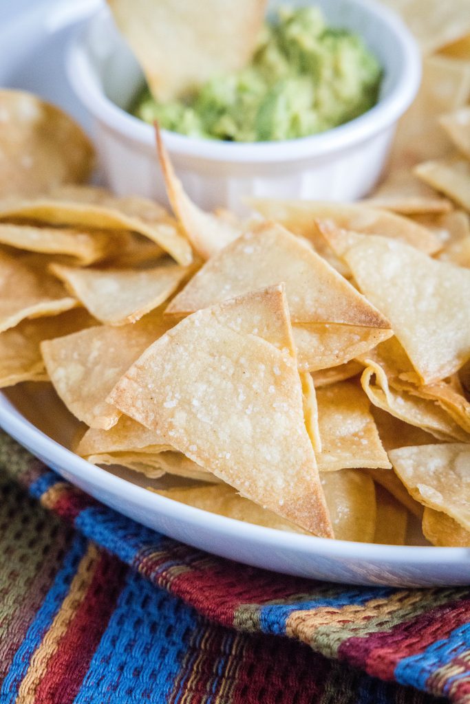 tortilla chips in a bowl with guacamole