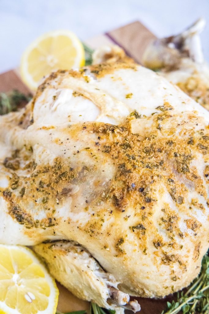 instant pot whole chicken in on a cutting board
