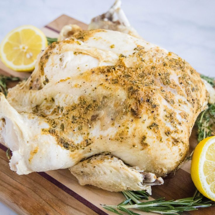 cropped close up instant pot whole chicken on a cutting board