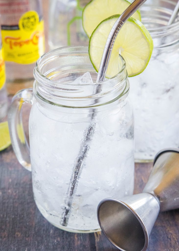 ranch water in a glass with a metal straw