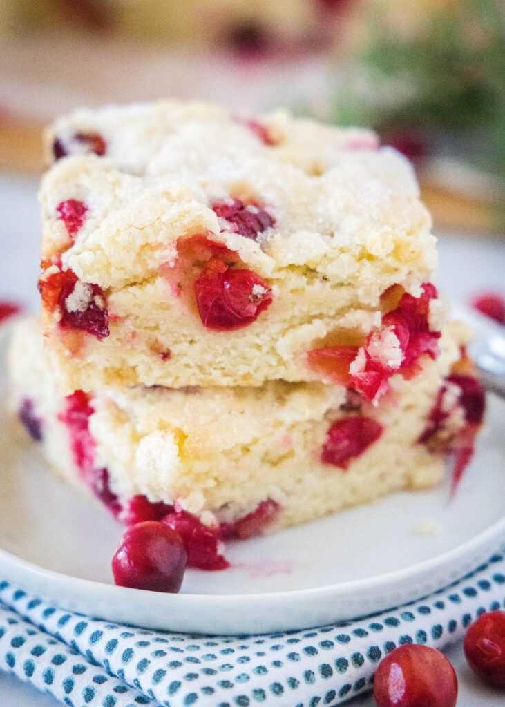stacked cranberry coffee cake on a white plate