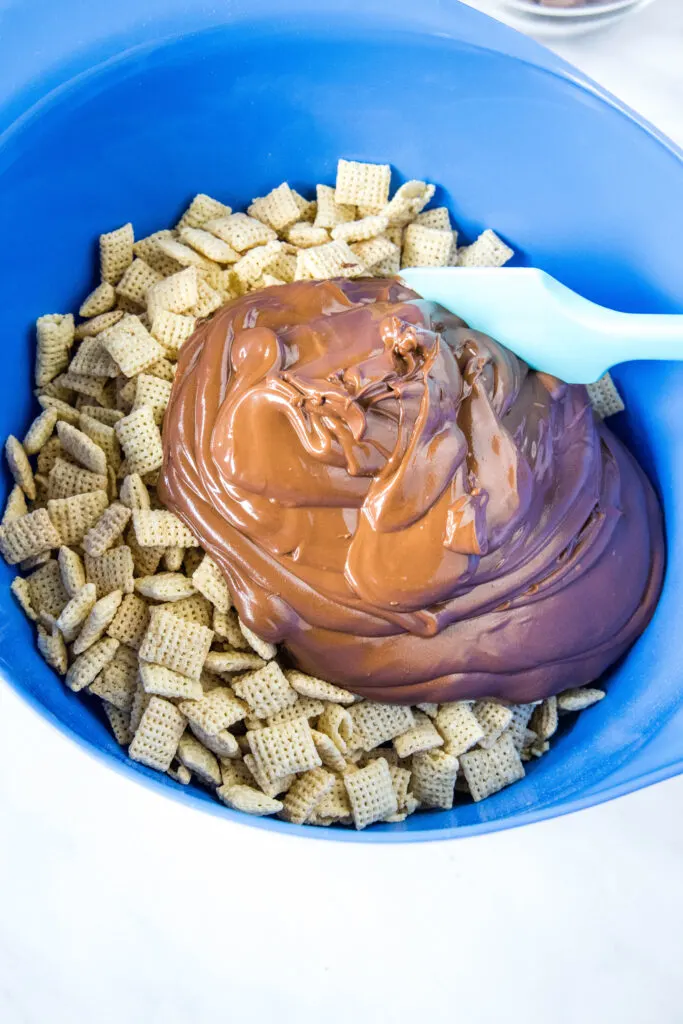 adding melted chocolate to chex cereal