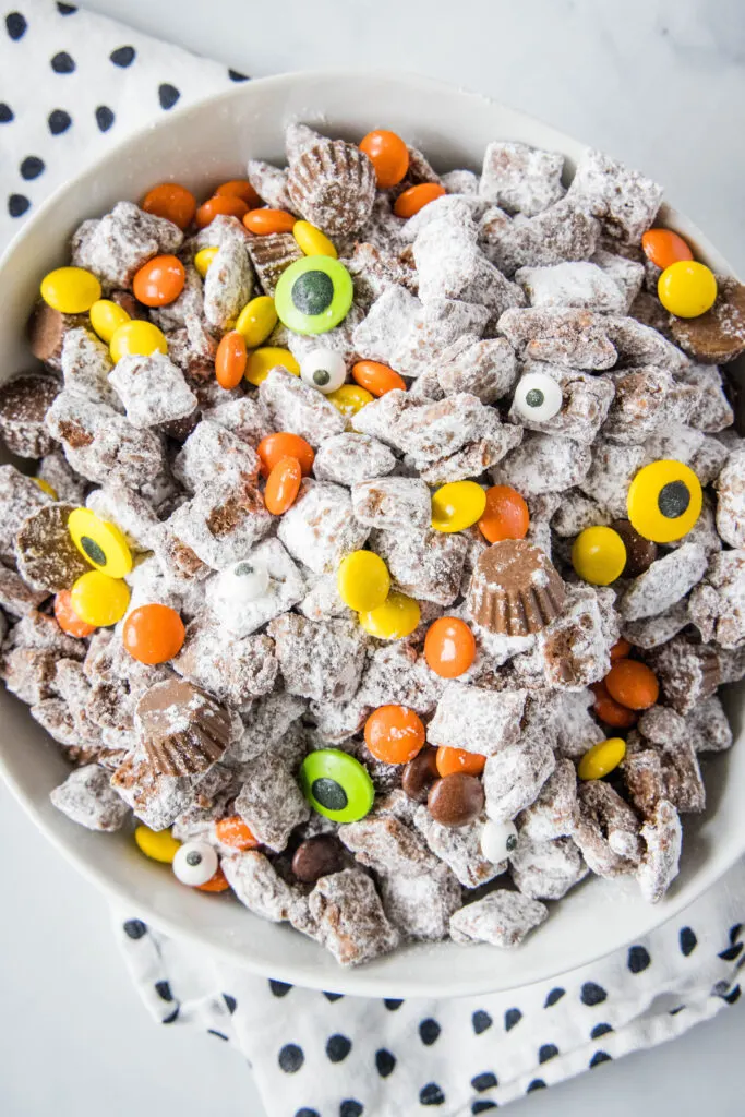 looking down on a bowl of halloween muddy buddies