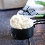 cropped close up measuring cup with bisquick