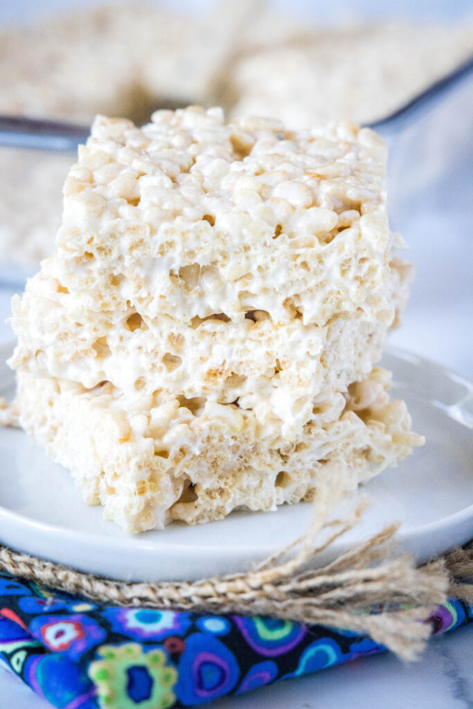 stacked rice krispie treats on a white plate