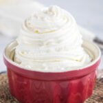 Close up of a ramekin full of stabilized whipped cream